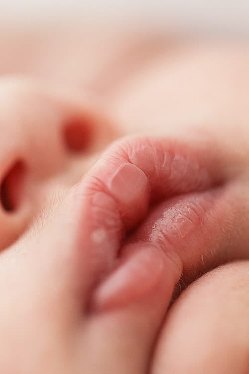 Macro detail of a newborn's lips and chin