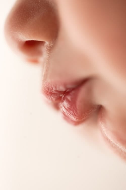 Macro detail of a newborn's nose and lips