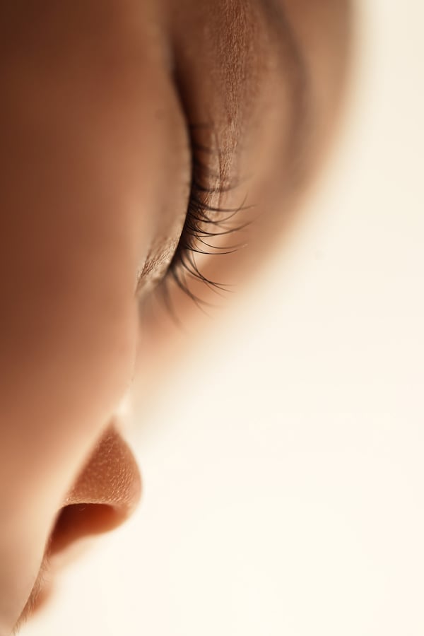 Extreme close-up of a sleeping newborn's eyelashes